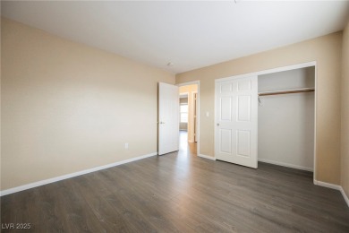 Experience refined living in this elegant 4-bedroom, 3-bath on Rhodes Ranch Golf Club in Nevada - for sale on GolfHomes.com, golf home, golf lot