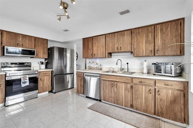 Experience peaceful Florida living in this bright, open villa on Caloosa Greens Executive Golf Course in Florida - for sale on GolfHomes.com, golf home, golf lot