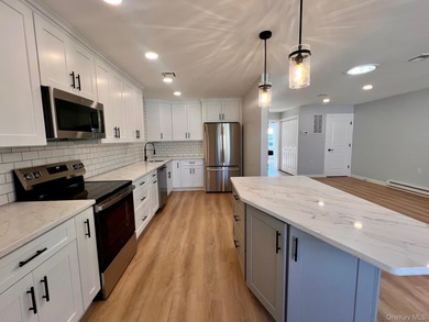 Reimagined. Elevated to a new level. This completely transformed on Leisure Village Golf Course in New York - for sale on GolfHomes.com, golf home, golf lot