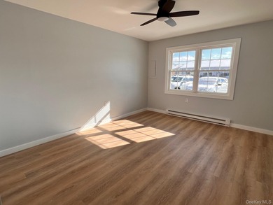 Reimagined. Elevated to a new level. This completely transformed on Leisure Village Golf Course in New York - for sale on GolfHomes.com, golf home, golf lot