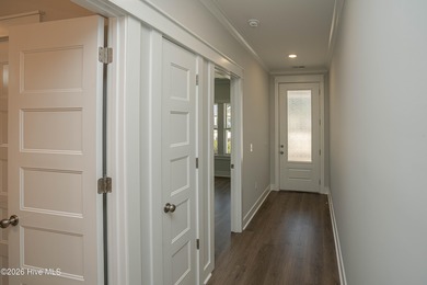 Location is everything, right? This brand new home is less than on Brick Landing Plantation Yacht and Golf Club in North Carolina - for sale on GolfHomes.com, golf home, golf lot