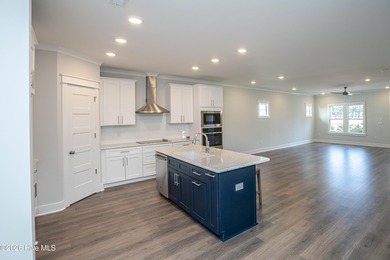 Location is everything, right? This brand new home is less than on Brick Landing Plantation Yacht and Golf Club in North Carolina - for sale on GolfHomes.com, golf home, golf lot