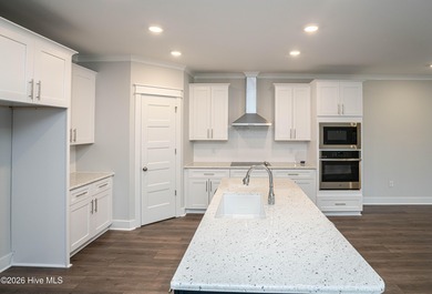 Location is everything, right? This brand new home is less than on Brick Landing Plantation Yacht and Golf Club in North Carolina - for sale on GolfHomes.com, golf home, golf lot