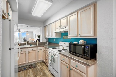 This exquisite penthouse offers stunning views of the on Isla Del Sol Yacht and Country Club in Florida - for sale on GolfHomes.com, golf home, golf lot