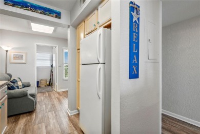 This exquisite penthouse offers stunning views of the on Isla Del Sol Yacht and Country Club in Florida - for sale on GolfHomes.com, golf home, golf lot