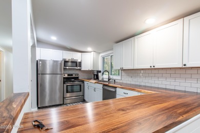 Welcome to this beautifully updated single-floor ranch home on Lords Valley Country Club, Inc in Pennsylvania - for sale on GolfHomes.com, golf home, golf lot