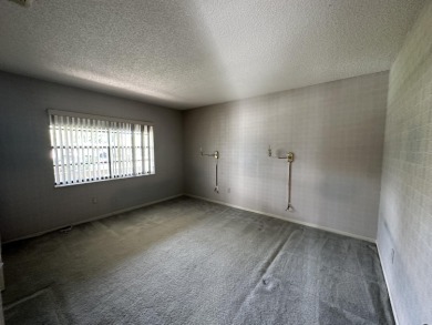 Corner unit on second floor with nice size patio to relax with on Hunters Run Golf and Country Club in Florida - for sale on GolfHomes.com, golf home, golf lot