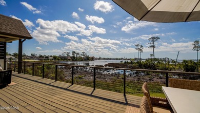 Experience waterfront living in Bay Point with front-row seats on Bay Point Resort Golf Club in Florida - for sale on GolfHomes.com, golf home, golf lot
