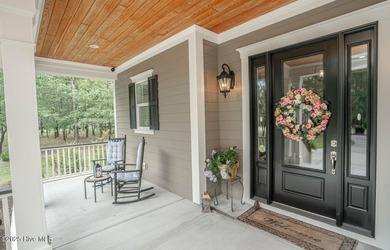 Hello Curb Appeal! A low country inspired 4BR and 3.5BA home on Ocean Ridge Plantation in North Carolina - for sale on GolfHomes.com, golf home, golf lot