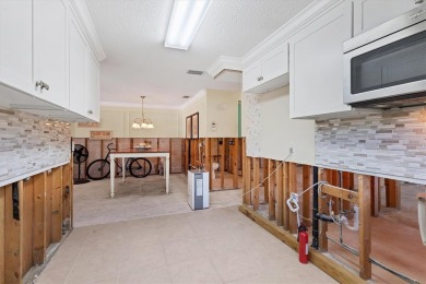 Under contract-accepting backup offers. LOWEST PRICED SFR on Key Royale Club in Florida - for sale on GolfHomes.com, golf home, golf lot
