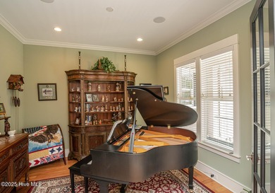 Hello Curb Appeal! A low country inspired 4BR and 3.5BA home on Ocean Ridge Plantation in North Carolina - for sale on GolfHomes.com, golf home, golf lot