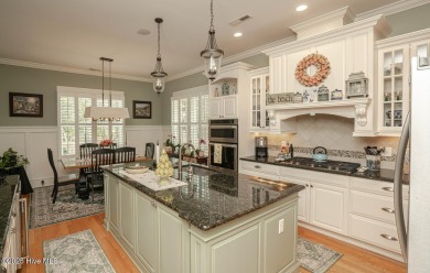 Hello Curb Appeal! A low country inspired 4BR and 3.5BA home on Ocean Ridge Plantation in North Carolina - for sale on GolfHomes.com, golf home, golf lot