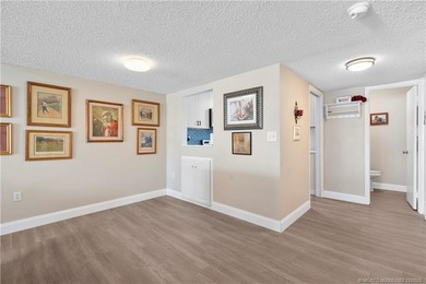 Fully renovated with quality finishes, this light and bright 1 on Miles Grant Country Club in Florida - for sale on GolfHomes.com, golf home, golf lot