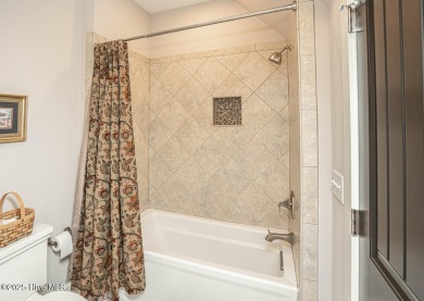 Hello Curb Appeal! A low country inspired 4BR and 3.5BA home on Ocean Ridge Plantation in North Carolina - for sale on GolfHomes.com, golf home, golf lot