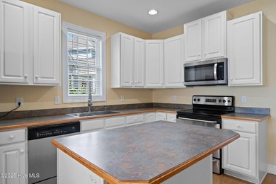 This classic all-brick home is located at the end of a private on Members Club At St. James Plantation in North Carolina - for sale on GolfHomes.com, golf home, golf lot