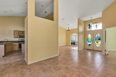 Opportunity to own this 4-bedroom, 3 bath pool home in on Wedgefield Golf Club in Florida - for sale on GolfHomes.com, golf home, golf lot