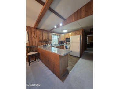 BEAUTIFUL TANGLWOOD LAKES RAISED RANCH AT LAKE WALLENPAUPACK! on Paupack Hills Golf and Country Club in Pennsylvania - for sale on GolfHomes.com, golf home, golf lot