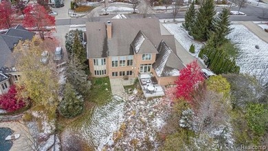 Perched gracefully above the landscape, this Oakhurst residence on Oakhurst Golf and Country Club in Michigan - for sale on GolfHomes.com, golf home, golf lot