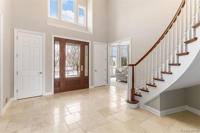 Perched gracefully above the landscape, this Oakhurst residence on Oakhurst Golf and Country Club in Michigan - for sale on GolfHomes.com, golf home, golf lot