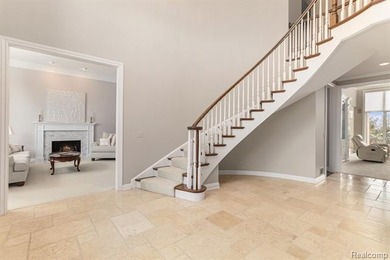 Perched gracefully above the landscape, this Oakhurst residence on Oakhurst Golf and Country Club in Michigan - for sale on GolfHomes.com, golf home, golf lot