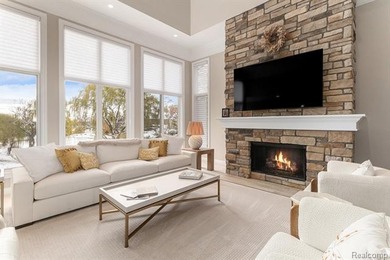 Perched gracefully above the landscape, this Oakhurst residence on Oakhurst Golf and Country Club in Michigan - for sale on GolfHomes.com, golf home, golf lot