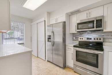 Welcome to your dream condo or ideal investment property! on PGA National Golf Club in Florida - for sale on GolfHomes.com, golf home, golf lot