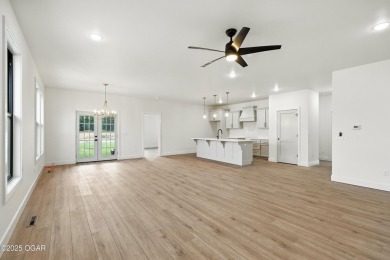 Welcome to 4402 Par Ln, a beautifully designed new construction on Twin Hills Golf and Country Club in Missouri - for sale on GolfHomes.com, golf home, golf lot