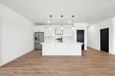 Welcome to 4308 Par Ln, a beautifully designed new construction on Twin Hills Golf and Country Club in Missouri - for sale on GolfHomes.com, golf home, golf lot