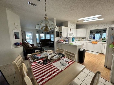 MOTIVATED SELLER ~ NEW REDUCED PRICE! Nestled on the Chain of on Four Lakes Golf Club in Florida - for sale on GolfHomes.com, golf home, golf lot