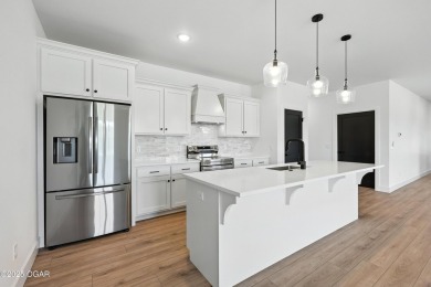 Welcome to 4308 Par Ln, a beautifully designed new construction on Twin Hills Golf and Country Club in Missouri - for sale on GolfHomes.com, golf home, golf lot