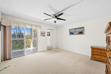 Spacious 2-bedroom, 2-bathroom top-floor condo overlooking a on  in Florida - for sale on GolfHomes.com, golf home, golf lot