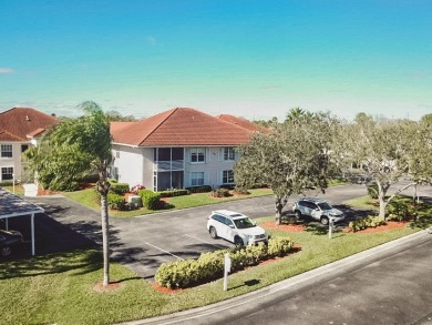 All age community. 2nd floor unit with pond water views. New AC on The American Golf Club in Florida - for sale on GolfHomes.com, golf home, golf lot