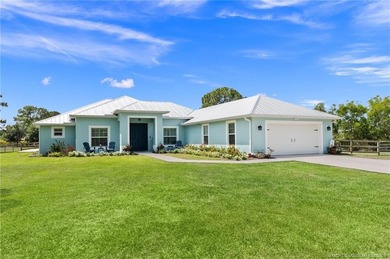 Every day is a vacation in this custom CBS 4 bedroom, 4.5 bath on The Cape Club of Palm City in Florida - for sale on GolfHomes.com, golf home, golf lot