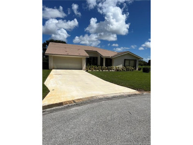 Needs TLC...the future buyer will remodel this home and at this on Martin Downs Country Club in Florida - for sale on GolfHomes.com, golf home, golf lot