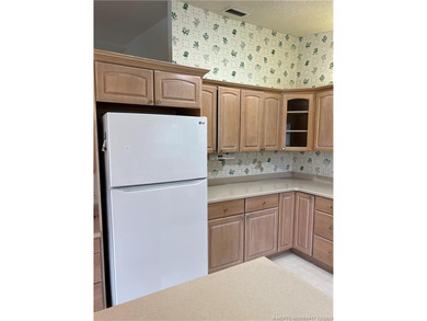 Needs TLC...the future buyer will remodel this home and at this on Martin Downs Country Club in Florida - for sale on GolfHomes.com, golf home, golf lot