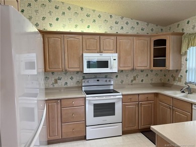 Needs TLC...the future buyer will remodel this home and at this on Martin Downs Country Club in Florida - for sale on GolfHomes.com, golf home, golf lot