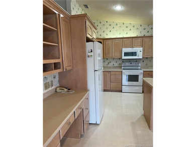 Needs TLC...the future buyer will remodel this home and at this on Martin Downs Country Club in Florida - for sale on GolfHomes.com, golf home, golf lot