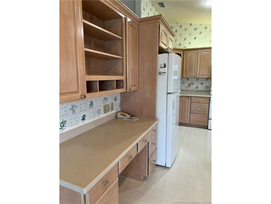 Needs TLC...the future buyer will remodel this home and at this on Martin Downs Country Club in Florida - for sale on GolfHomes.com, golf home, golf lot