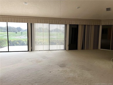 Needs TLC...the future buyer will remodel this home and at this on Martin Downs Country Club in Florida - for sale on GolfHomes.com, golf home, golf lot