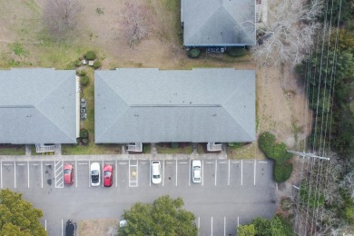 Welcome to 1301 Pidgen Rd Unit 1101, a beautiful first-floor end on Whispering Pines in South Carolina - for sale on GolfHomes.com, golf home, golf lot