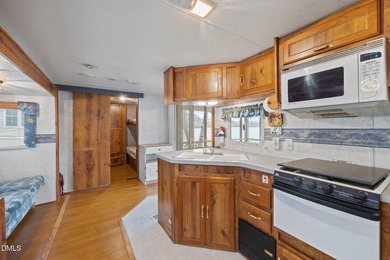 START LIVING THE LAKE LIFE NOW!! WATERFRONT GET-AWAY WITH 75 FT on River Golf and Country Club at Lake Royale in North Carolina - for sale on GolfHomes.com, golf home, golf lot