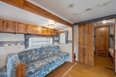 START LIVING THE LAKE LIFE NOW!! WATERFRONT GET-AWAY WITH 75 FT on River Golf and Country Club at Lake Royale in North Carolina - for sale on GolfHomes.com, golf home, golf lot