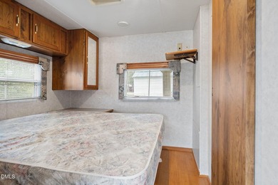 START LIVING THE LAKE LIFE NOW!! WATERFRONT GET-AWAY WITH 75 FT on River Golf and Country Club at Lake Royale in North Carolina - for sale on GolfHomes.com, golf home, golf lot