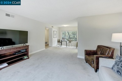 Find serenity in this lovely unit! Open concept living space on Rossmoor Golf Course in California - for sale on GolfHomes.com, golf home, golf lot