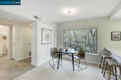 Find serenity in this lovely unit! Open concept living space on Rossmoor Golf Course in California - for sale on GolfHomes.com, golf home, golf lot