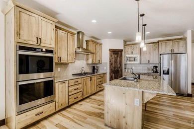 Experience refined Colorado living in this stunning Hudson model on Raindance National Golf Course in Colorado - for sale on GolfHomes.com, golf home, golf lot