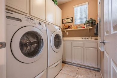 Listing courtesy of Lori Robinson, Coldwell Banker ABR on Menifee Lakes Country Club - Lakes in California - for sale on GolfHomes.com, golf home, golf lot