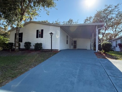 This 1560 square foot home has a unique very spacious floor on Whisperwood Golf Course in Florida - for sale on GolfHomes.com, golf home, golf lot