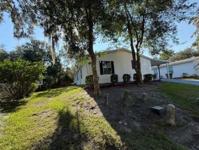 This 1560 square foot home has a unique very spacious floor on Whisperwood Golf Course in Florida - for sale on GolfHomes.com, golf home, golf lot