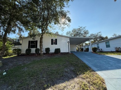 This 1560 square foot home has a unique very spacious floor on Whisperwood Golf Course in Florida - for sale on GolfHomes.com, golf home, golf lot